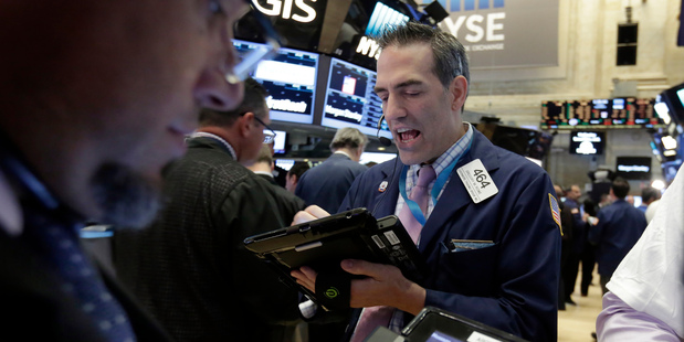 Trader Gregory Rowe works on the floor of the New York Stock Exchange. Photo / AP