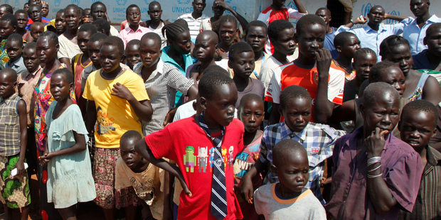 Refugees wait in the remote northwestern district of Adjumani, near the border with South Sudan, in Uganda. Photo / AP