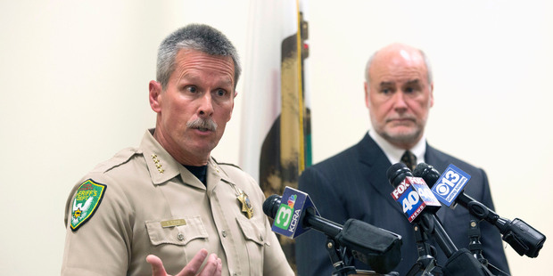Yuba County Sheriff Steven Durfor, left, discusses the arrests made related to the 1973 killings of two California girls, at a news conference. Photo / AP