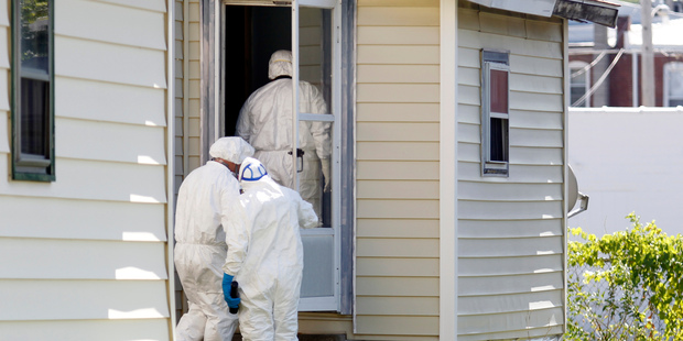 Ashland Police Department and Ohio BCI execute a search warrant on a home where a woman had been abducted. Photo / AP