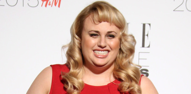 Rebel Wilson has lost a considerable amount a weight, which she flaunts at her Pitch Perfect co star's wedding. Photo / AP