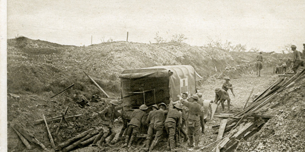 BATTLEGROUND: Soldiers help an ambulance through the mud during the battle of the Somme.