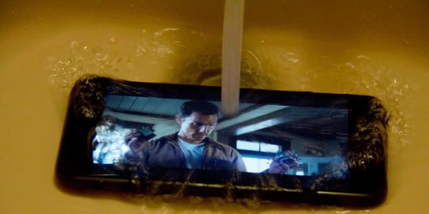 The new iPhone is protected from immersion in liquid to a depth of 1m for 30 minutes. Photo / AP