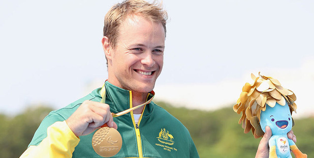 Curtis McGrath of Australia poses on the medals podium after winning the men's KL2 final at Lagoa Stadium. Photo / Getty