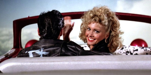 What does Olivia Newton John think about the theory about her character being dead in Grease?