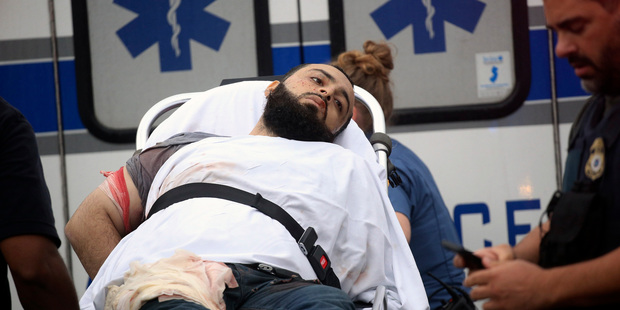 Ahmad Khan Rahami is taken into custody after a shootout with police. Photo / AP