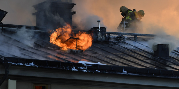 Firefighters try to extinguishing a fire at the Royal Institute of Art in Stockholm, Sweden. Photo / AP