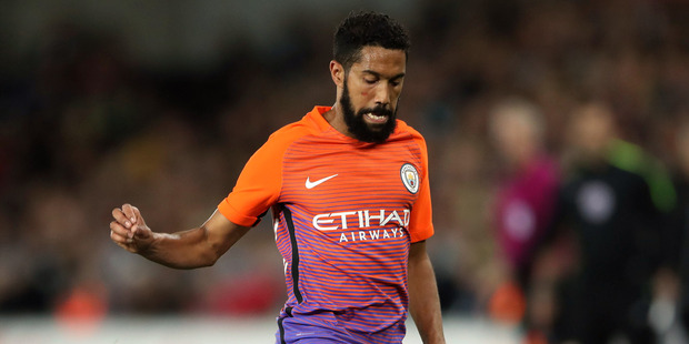 Manchester City fullback Gael Clichy sports Manchester City's controversial third kit in this morning's League Cup clash against Swansea City. Photo / AP