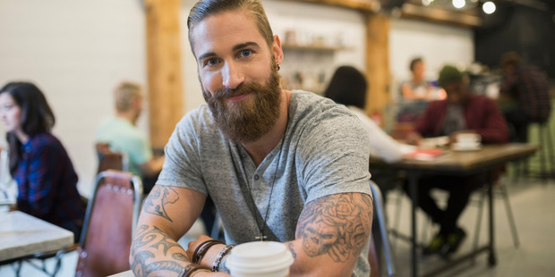 Research has found that having tattoos can actually increase a candidate's chance at employment. Photo / Getty
