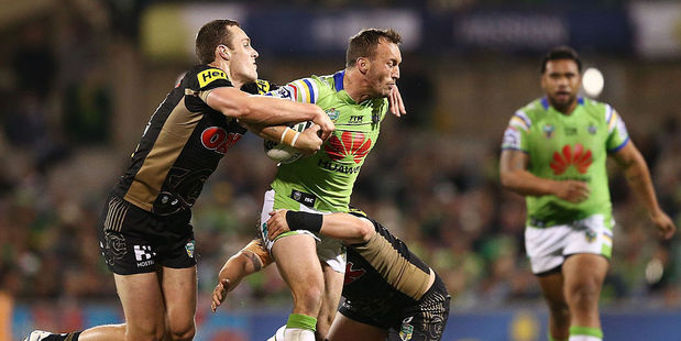 Josh Hodgson of the Raiders is tackled during the second NRL Semi Final match between the Canberra Raiders and the Penrith Panthers. Photo / Getty Images