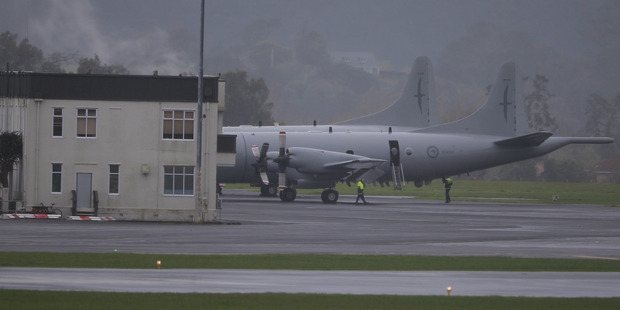 An RNZAF Orion plane seen on the Whenuapai airbase after an electrical emergency forced crew to evacuate. Photo / Nick Reed