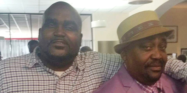 Terence Crutcher, left, with his father, Joey Crutcher. Photo / AP