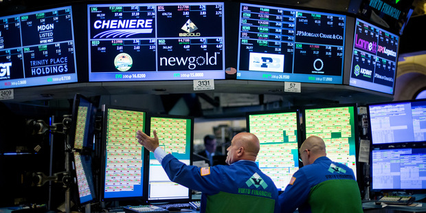 The Dow fell as slides in shares of American Express and those of Wal-Mart. Photo / AP