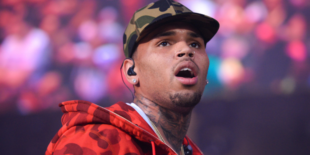 Rapper Chris Brown has been denied entry to Japan over an ongoing investigation relating to him allegedly threatening a woman at his house with a gun. Photo / AP