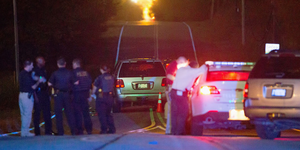 Police work the scene of a shooting late in Tulsa, Oklahoma. Photo / AP