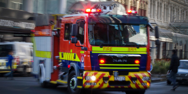 A person has been seriously injured in a house fire in Hastings tonight. Photo / Nick Reed