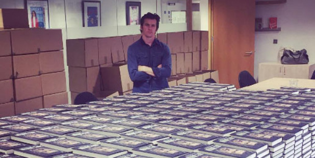 Footballer Joey Barton with the hundreds of books he had to sign. Photo / Instagram