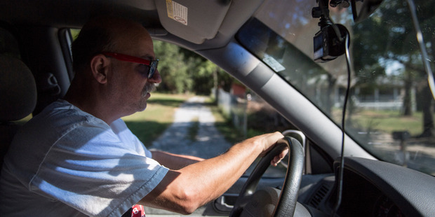 Jim Cooley drives his van with five security cameras recording to the grocery store in Winder, Ga. Photo / The Washington Post / Jabin Botsford