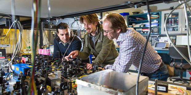 Postdoctoral fellows (from left) Daniel Oblak and Erhan Saglamyurek and Professor Wolfgang Tittel have teleported a photon over a distance of six kilometres. Photo: Riley Brandt/University of Calgary