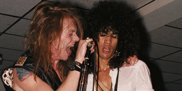 Axl Rose and Slash, pictured here in 1985, will put aside their differences for a string of Guns N' Roses shows in Vegas and at Coachella. Photo / Getty