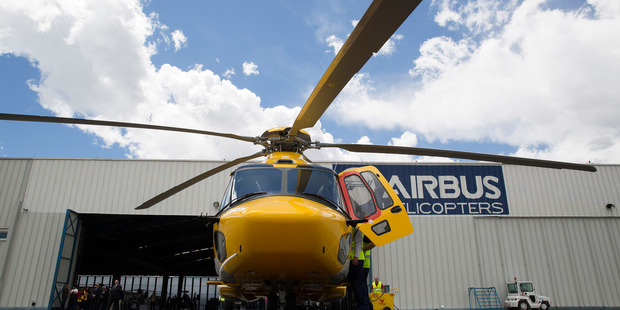 Workers make a final check on an Airbus helicopter before a demonstration flight in Mexico City. Photo / Bloomberg