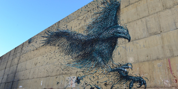 Dal East's mural of Haast's Eagle on Dunedin's Street Art Trail. Other artists include Pixel Pancho's horse and rider, Dunedin artist Jon Thom's portrait and ROA's tuatara. Image / Chris Allan