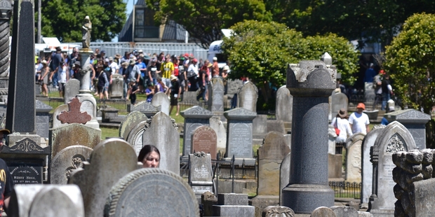 CEMETERY CIRCUIT: Heads Rd Cemetery, resting place of many of the city's ancestors, pictured on the one occasion each year when it is heavily frequented by the living - during the Cemetery Circuit motorcycle races on Boxing Day. It will be quieter than this for Wednesday's Summer Programme tour.