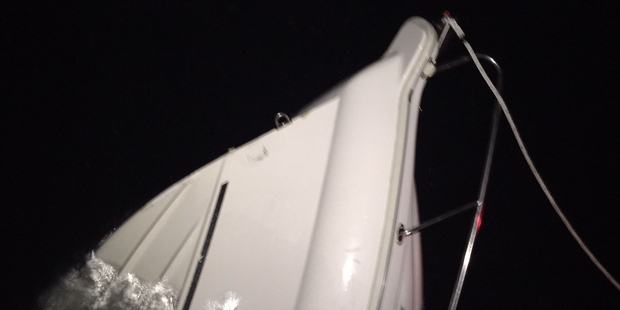 Only the powerboat's bow was still above water when the boatie was rescued. Photo / supplied