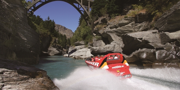 The Shotover Jet heads for Edith Cavell Bridge, just out of Queenstown. Photo / Supplied