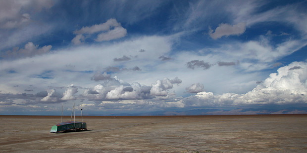 In this January 12 2016 photo, an abandoned boat lies on the dried up lake bed of Lake Poopo. Photo / AP