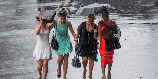 Race-goers brave the rain at Ellerslie Racecourse in Auckland earlier this month. More of the same awful weather is expected this week. Photo / Steven McNicholl.