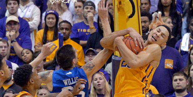 LSU forward Ben Simmons vies for a rebound with Kentucky forward Derek Willis during an NCAA college basketball game. Photo / AP