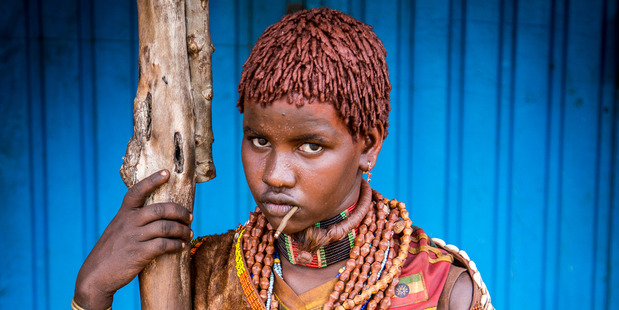 Hamar women are extremely photogenic, their beautiful black skin topped with copper-coloured goscha dreadlocks. Photo / Guy Needham