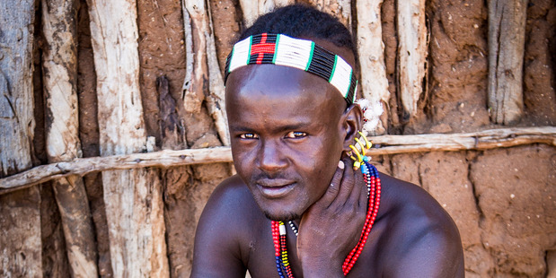The men's showpiece is their hair; they take great pride in shaping their locks and often accessorise with hairpins, feathers or clay-moulded hairpieces. Photo / Guy Needham