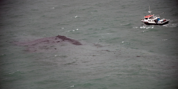 The aftermath of the boat sinking after a fire in Whakatane yesterday. Photo/George Novak