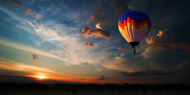 Climb into the basket of a hot air balloon at 5 o'clock in the morning, and you'll get to see the sunrise over the hills and the lush hinterland of the Gold Coast. Photo / 123RF