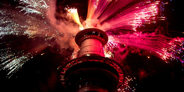 Fireworks explode off the Sky Tower in central Auckland. Photo / Dean Purcell