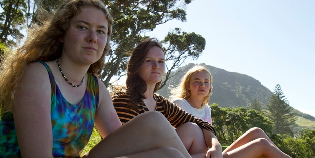 Clair Hill with friends Olivia Bell, and Jaimee Peterson are all gutted about the Mauao fire. Photo / Ruth Keber