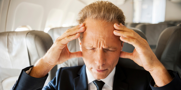 Having the middle seat in a plane can be stressful. Photo / Getty Images