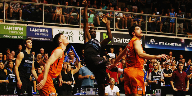 Ekene Ibekwe secures the NBL title for the Breakers.