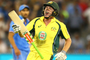James Faulkner of Australia celebrates hitting the winning runs against India. Photo / Getty