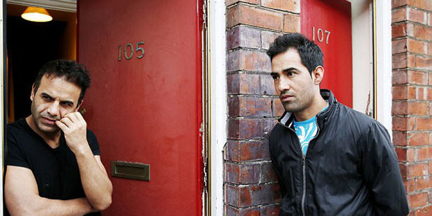 Asylum seekers Ajmal Kadari, left, and Rahumullah Ahmedi, said the doors made them a target.