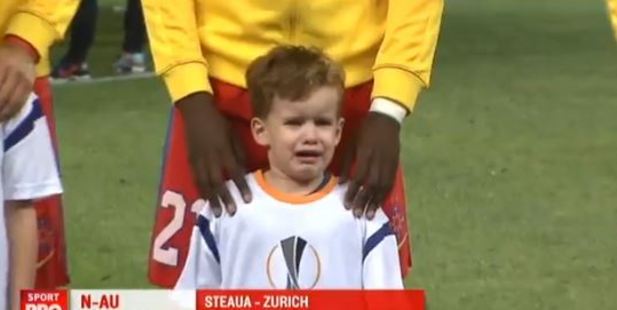 A young fan at a Europa League football match was less than excited about his appearance in front of 50,000 people. Photo / Sport Pro TV