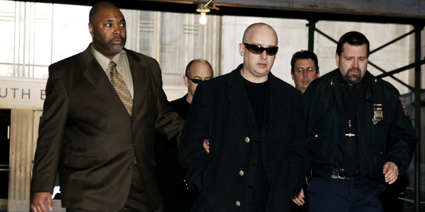 Boy George being escorted into New York Criminal Court in 2006, charged with fourth-degree criminal possession of a controlled substance. Photo / Getty Images