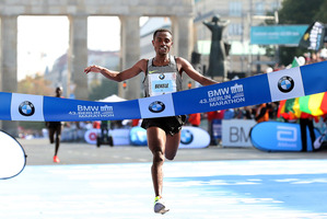Winner Kenenisa Bekele crosses the finish line during the 43rd BMW Berlin Marathon. Photo / Getty Images