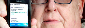 Trevor Dickason with one of the scam text messages he received. PHOTO/STUART MUNRO
