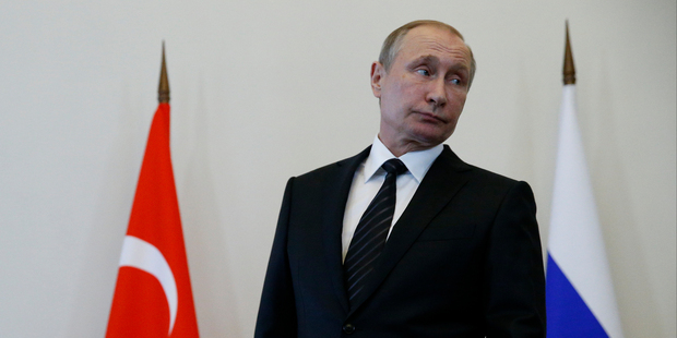 President Vladimir Putin has faced calls to admit what he knows about the MH17. Photo / AP