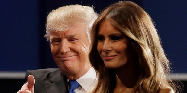 Republican presidential nominee Donald Trump walks off the stage with his wife Melania. Photo / AP