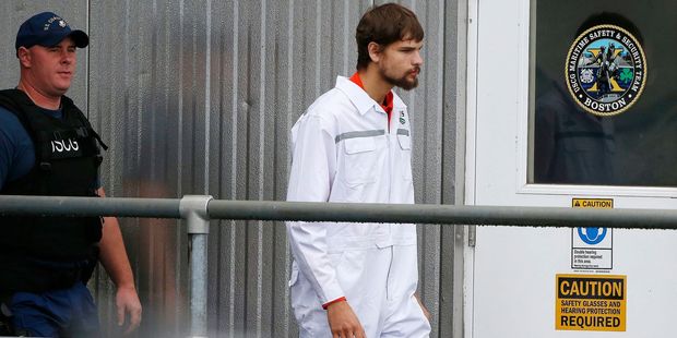 Nathan Carman disembarks at the US Coast Guard station in Boston on September 27, after a week at sea. Photo / AP