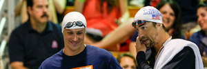 Ryan Lochte, left, and Michael Phelps talk before the start of the 100-metre butterfly final at the Arena Pro Swim Series meet in Charlotte, N.C. Photo / AP